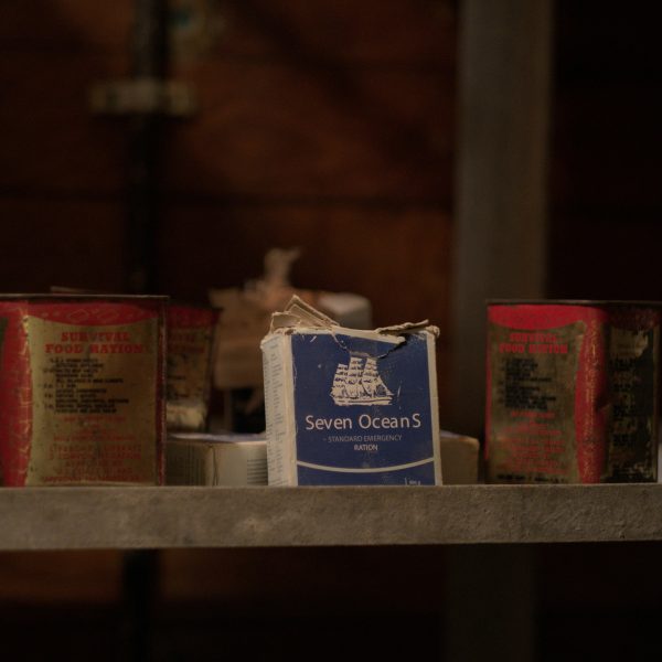 A box of Seven Oceans standard emergency ration flanked by two cans of survival food ration on a shelf. | outdoorsurvivors.com A box of Seven Oceans standard emergency ration flanked by two cans of survival food ration on a shelf | outdoorsurvivors com